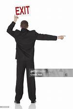 The Enigmatic Guy Holding Exit Sign: a Symbol of Departure and Reflection